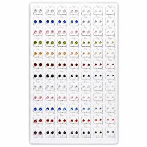 White jewelry display tray with colorful crystal stud earrings arranged in multiple rows