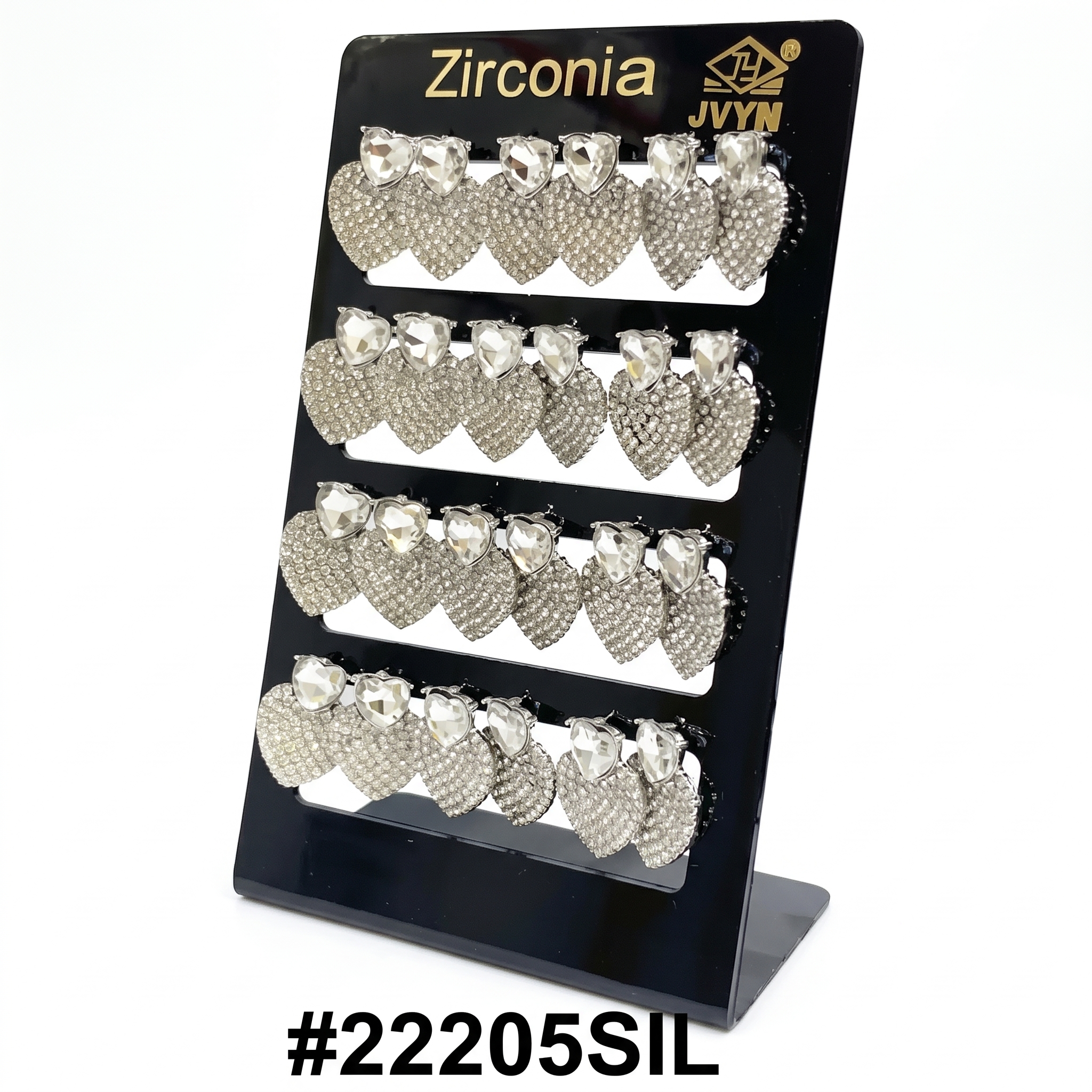 A retail display card showcasing multiple pairs of silver heart-shaped drop earrings adorned with glittering cubic zirconia stones, with the branding 'Zirconia' and 'JVYN' at the top, and the product code #22205SIL at the bottom, all against a pure white background."
