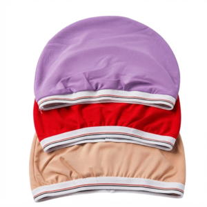 Stack of three solid color wide-band durags in purple, red, and beige, presented on a pure white background