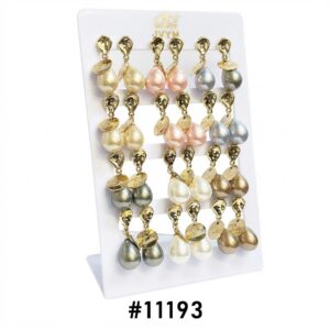NO Drop Shape Pearl With Coin Stud earrings displayed on a stand