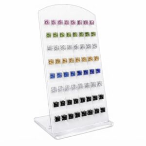 Colourful double sided earrings displayed in an organised stand