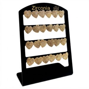 Heart shaped stud earrings in gold with zirconia detailing displayed on a stand