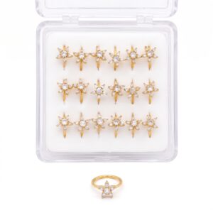 Gold starfish shaped nose rings displayed in a pack